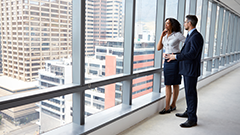 Business owners standing in an empty new office