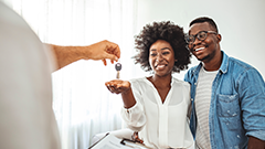 A couple receiving the keys to their new house