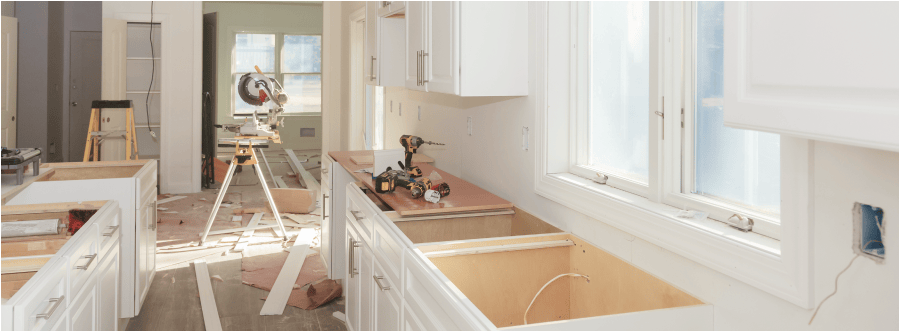 An in-progress kitchen renovation with newly installed cabinets