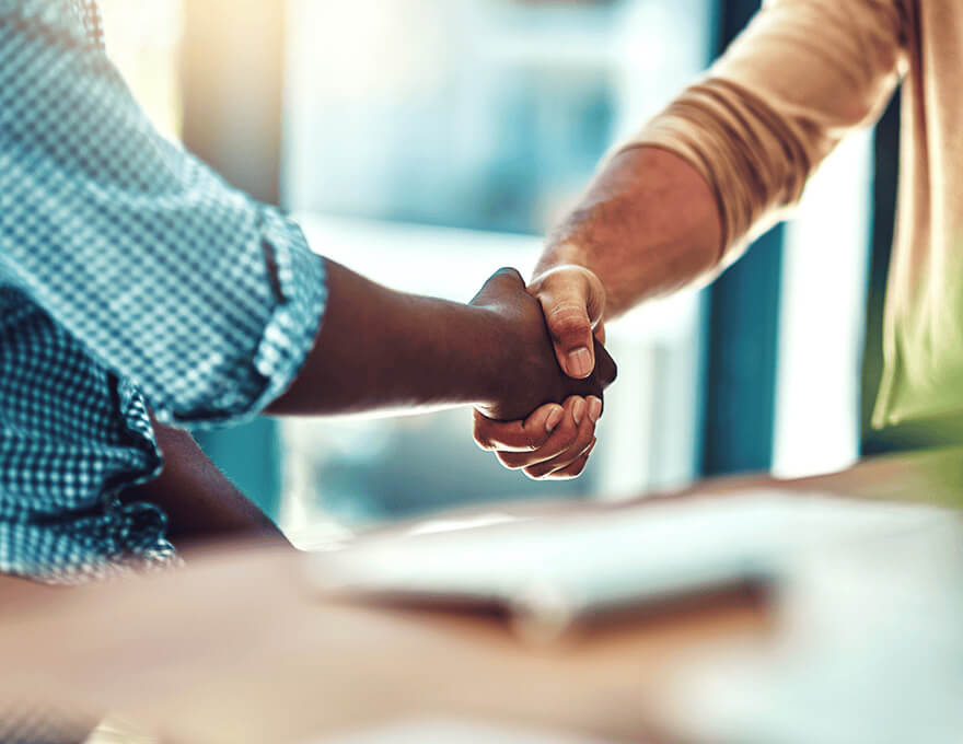 Two-men-shaking-hands-while-closing-a-deal-1