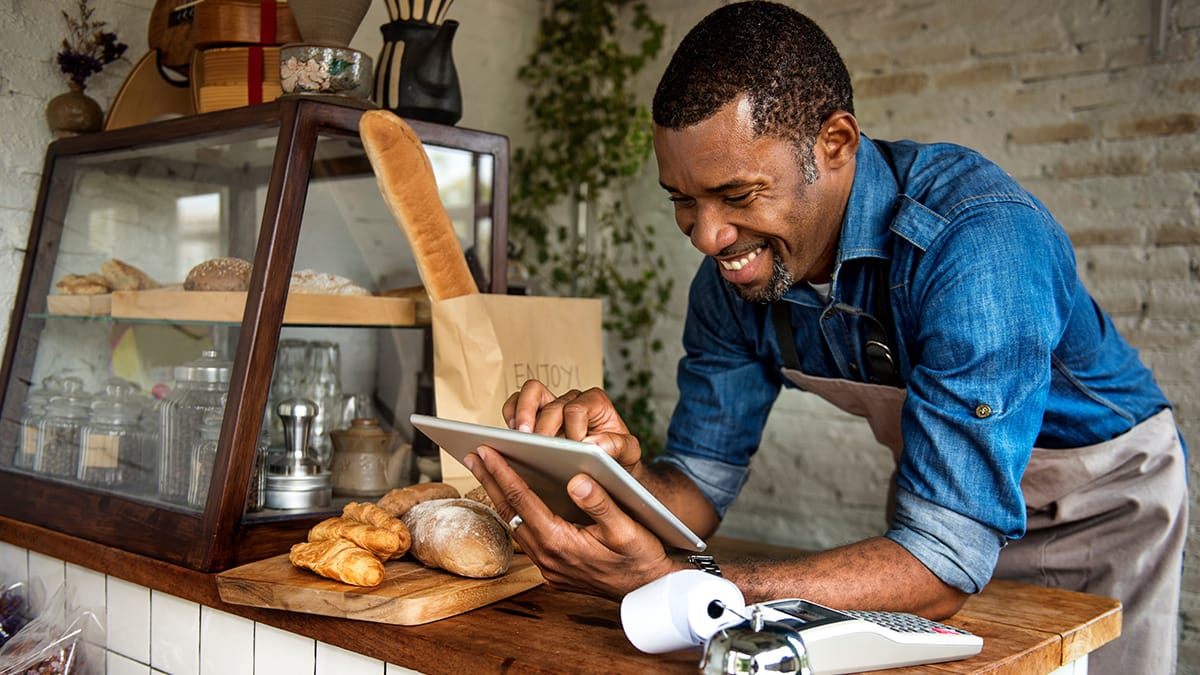 Small Business Owner standing at his bakery counter