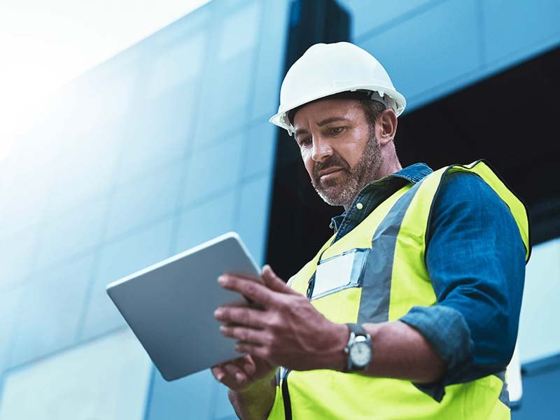 Constructor-looking-at-tablet