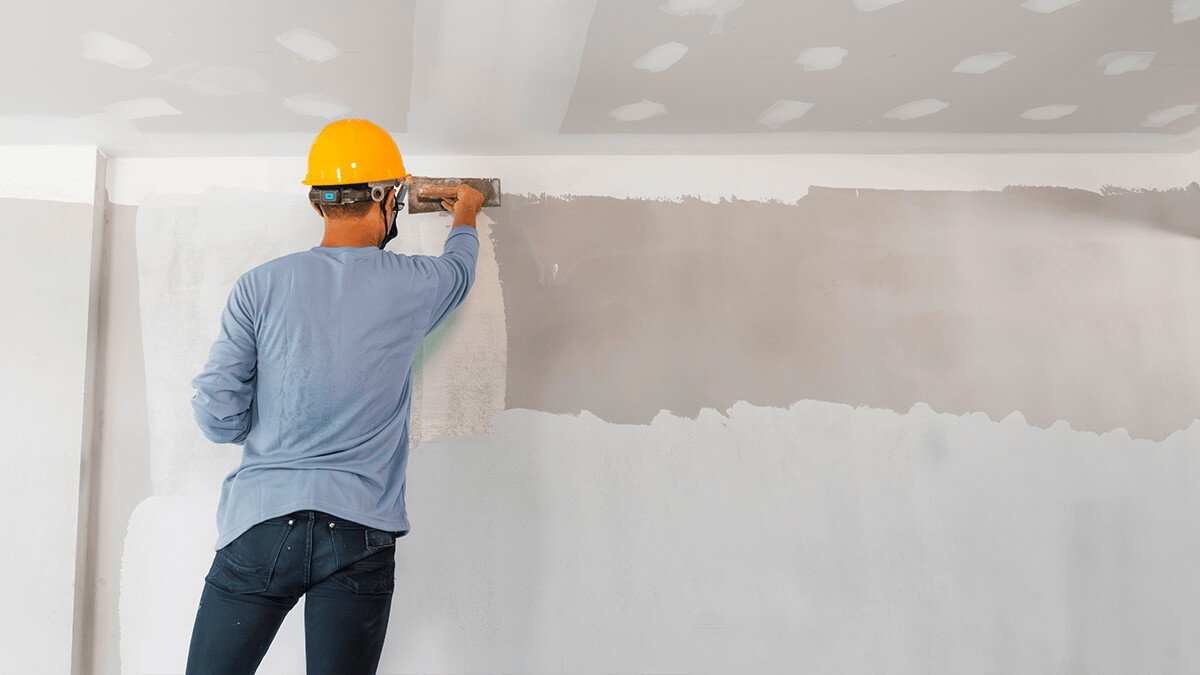 Man-plastering-wall-1