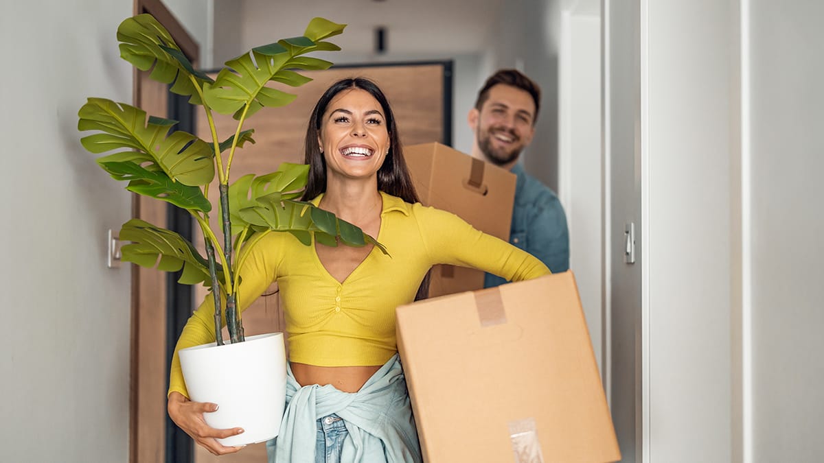 A happy couple moving into a new house