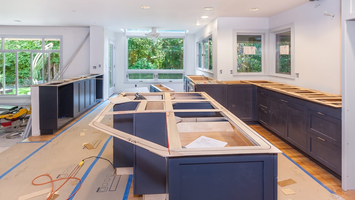 A kitchen mid-renovation with half-built cabinets