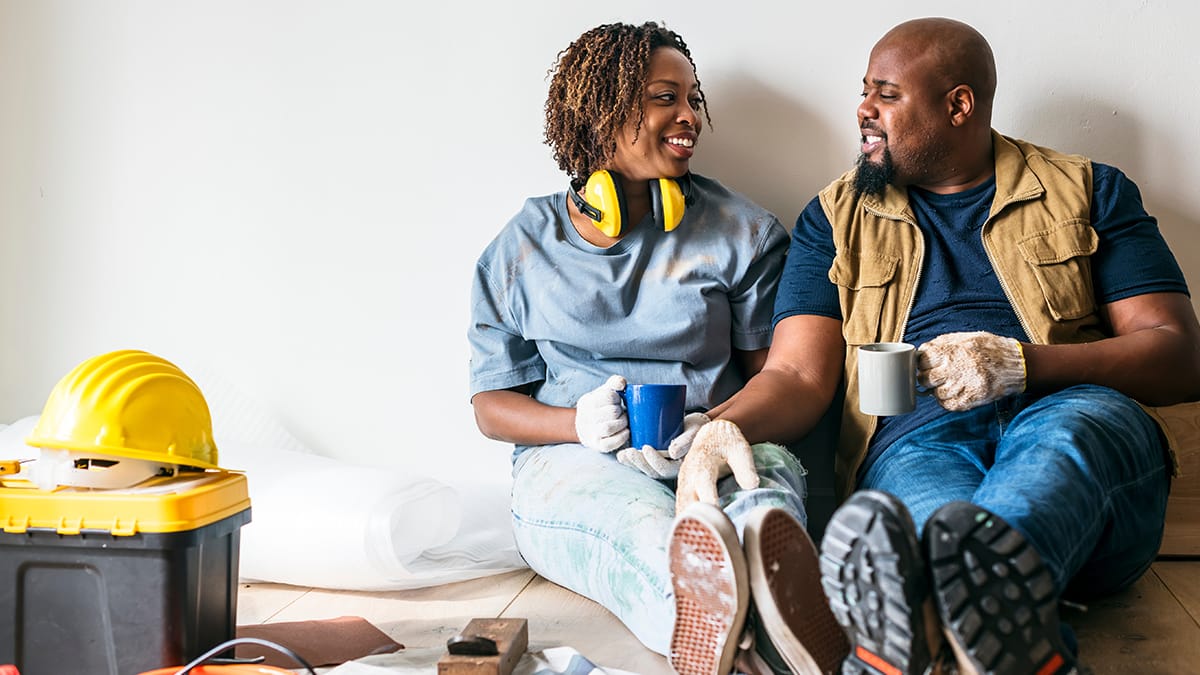 DIY homeowners taking a coffee break from renovations