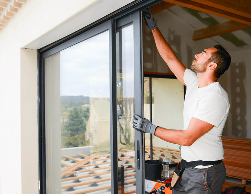 Man-installing-bay-window-in-a-house-1