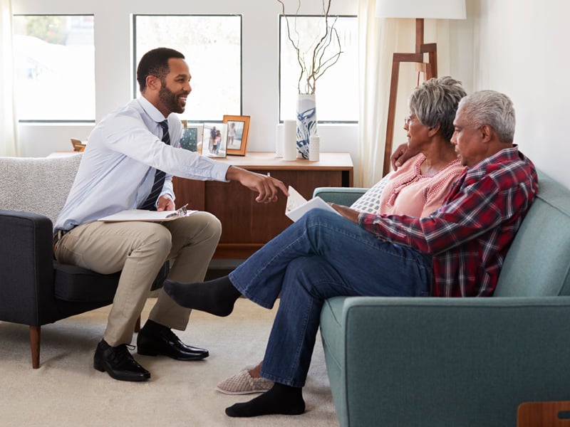 A loan officer speaking with a retiree
